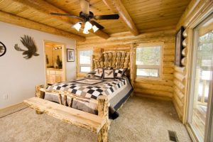 cabin bedroom with ceiling fan