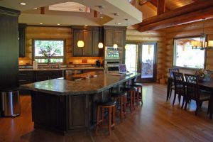 Log Home Interior Island with bar stools